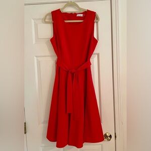 Calvin Klein sleeveless red dress, zip back size 12. Tie waist and dart detail.